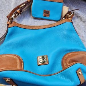 Dooney and Bourke Blue Shoulder Bag with Wristlet purse included.